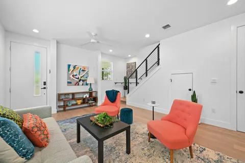 a kitchen with stainless steel appliances a sink and a refrigerator