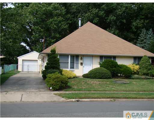 104 Idlewild Road Edison, NJ 08817 - Photo 1 of 13 a front view of a house with a yard