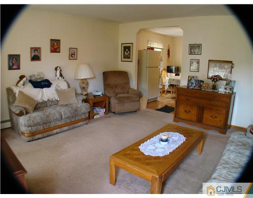 104 Idlewild Road Edison, NJ 08817 - Photo 2 of 13 a living room with furniture and a couch