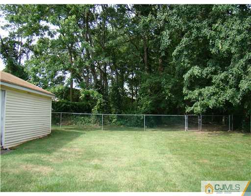 104 Idlewild Road Edison, NJ 08817 - Photo 13 of 13 a backyard of a house with lots of green space