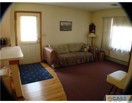 104 Idlewild Road Edison, NJ 08817 - Photo 6 of 13 a living room with furniture and a window