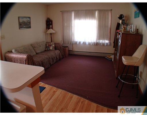 104 Idlewild Road Edison, NJ 08817 - Photo 7 of 13 a living room with furniture and a window