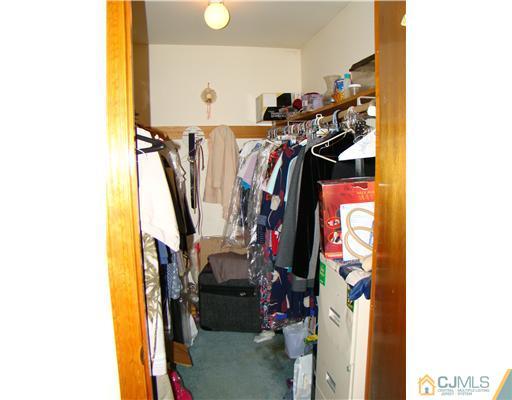 104 Idlewild Road Edison, NJ 08817 - Photo 9 of 13 a view of walk in closet with clothes