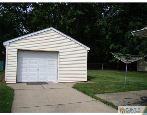 104 Idlewild Road Edison, NJ 08817 - Photo 10 of 13 a front view of a house with a garden