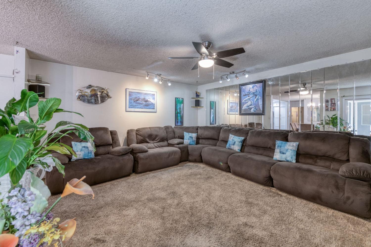 6811 North Backer Avenue Fresno, CA 93710 - Photo 11 of 26 a living room with furniture and a ceiling fan