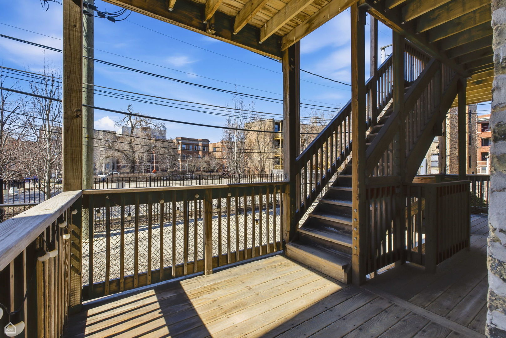 4444 North Beacon Street, Unit 1 Chicago, IL 60640 - Photo 14 of 18 a view of staircase with a metal railing and a large window