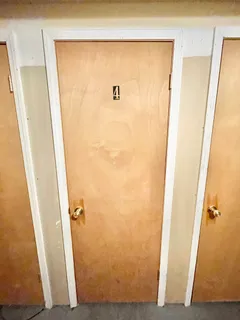 a bathroom with a shower and a sink