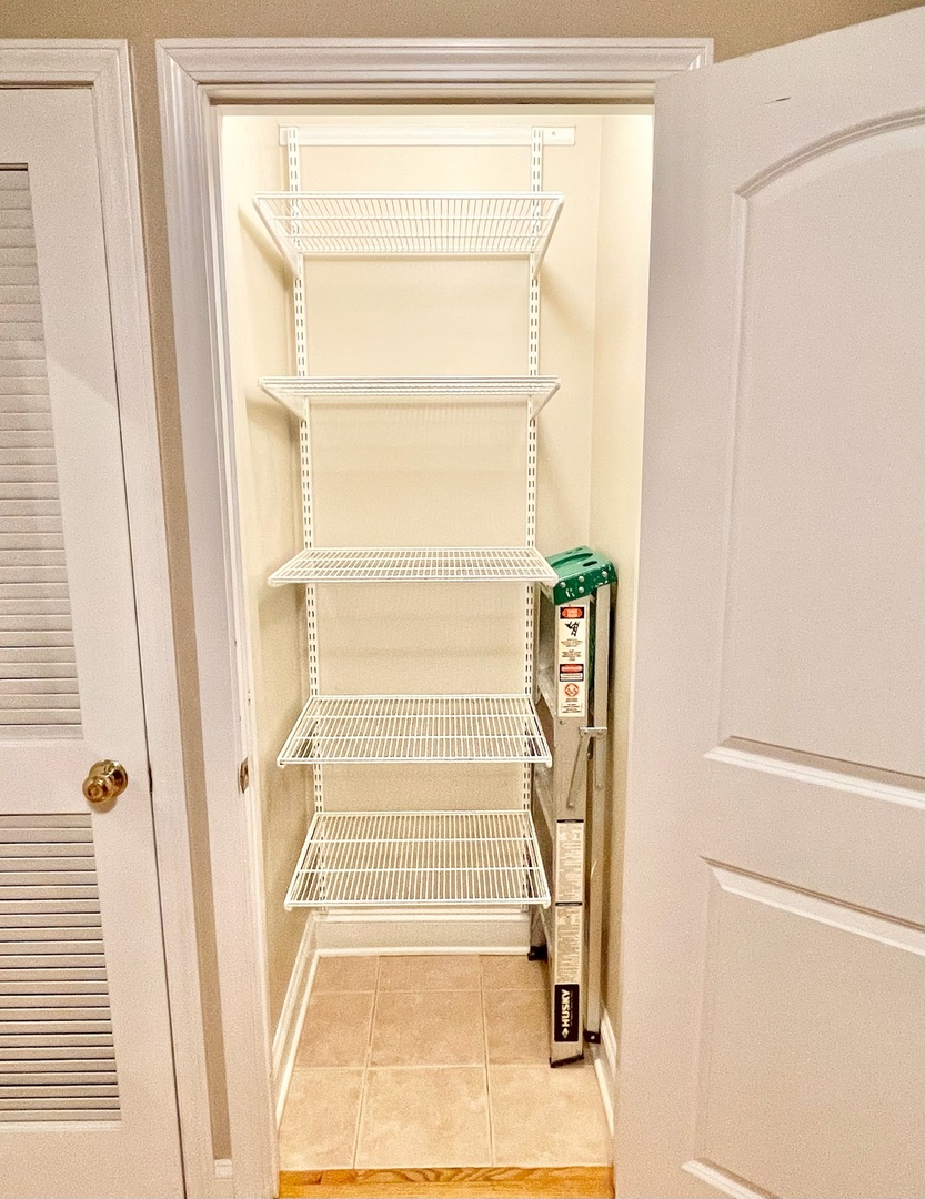 4444 North Beacon Street, Unit 1 Chicago, IL 60640 - Photo 9 of 18 a view of staircase with white walls and white door