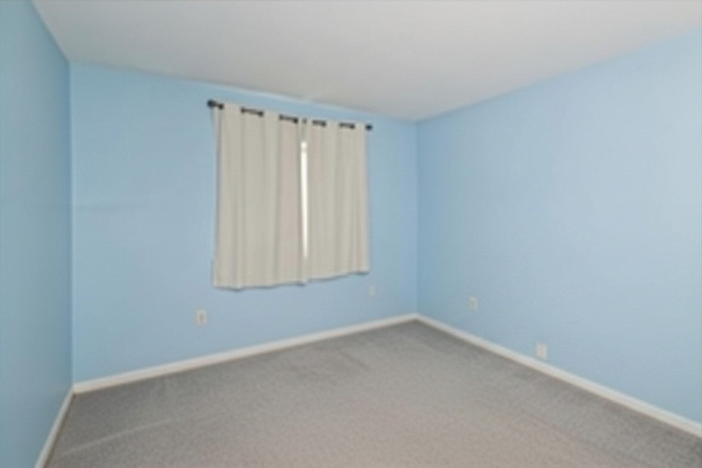 2 Universal Street, Unit 4 Framingham, MA 01702 - Photo 9 of 18 an empty room with a window