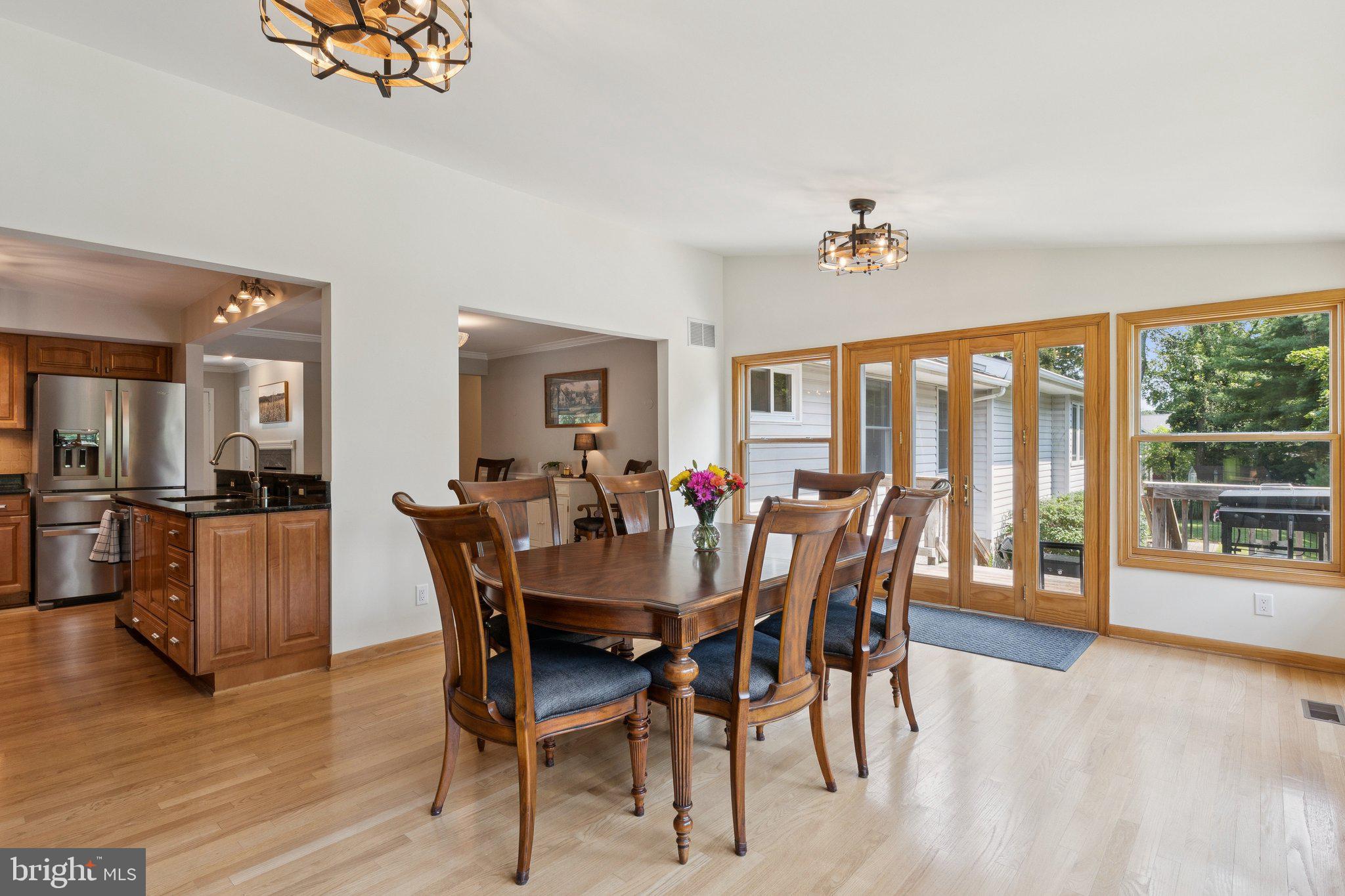 346 Edgewater Road Pasadena, MD 21122 - Photo 12 of 75 a view of a dining room with furniture window and wooden floor