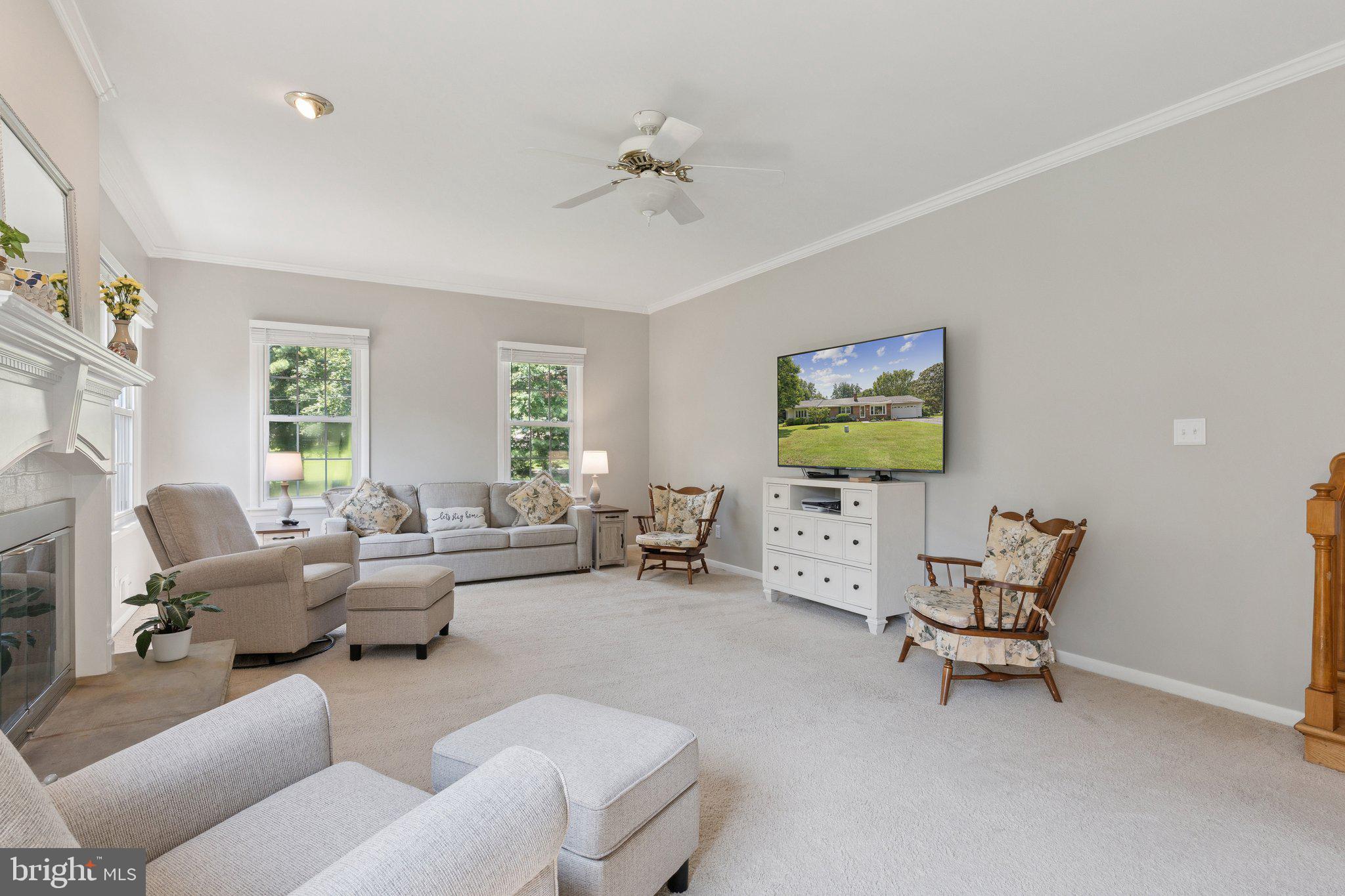 346 Edgewater Road Pasadena, MD 21122 - Photo 16 of 75 a living room with furniture and a chandelier