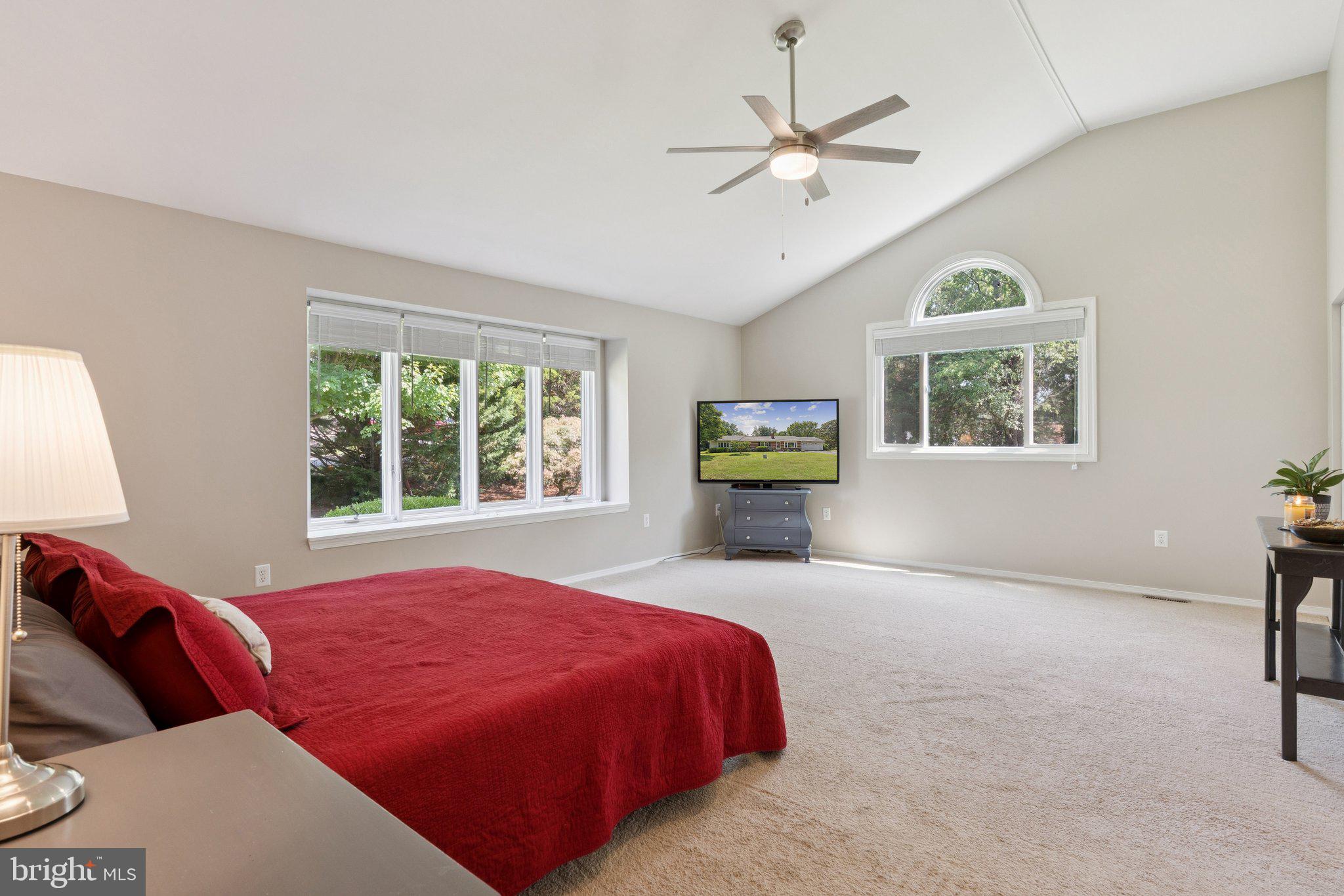 346 Edgewater Road Pasadena, MD 21122 - Photo 21 of 75 a bedroom with a bed a window and a chandelier