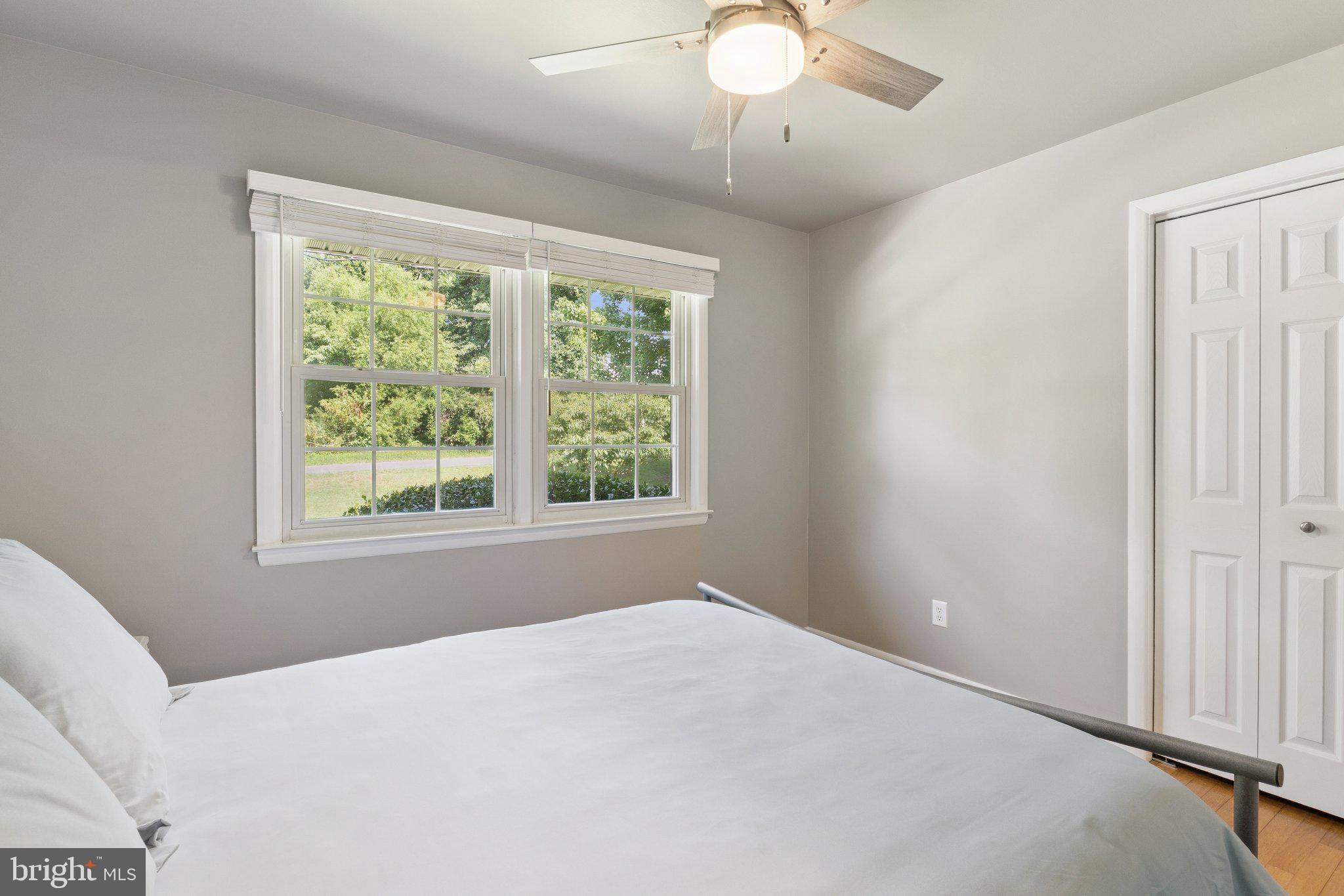346 Edgewater Road Pasadena, MD 21122 - Photo 33 of 75 a view of a livingroom with a ceiling fan and a window