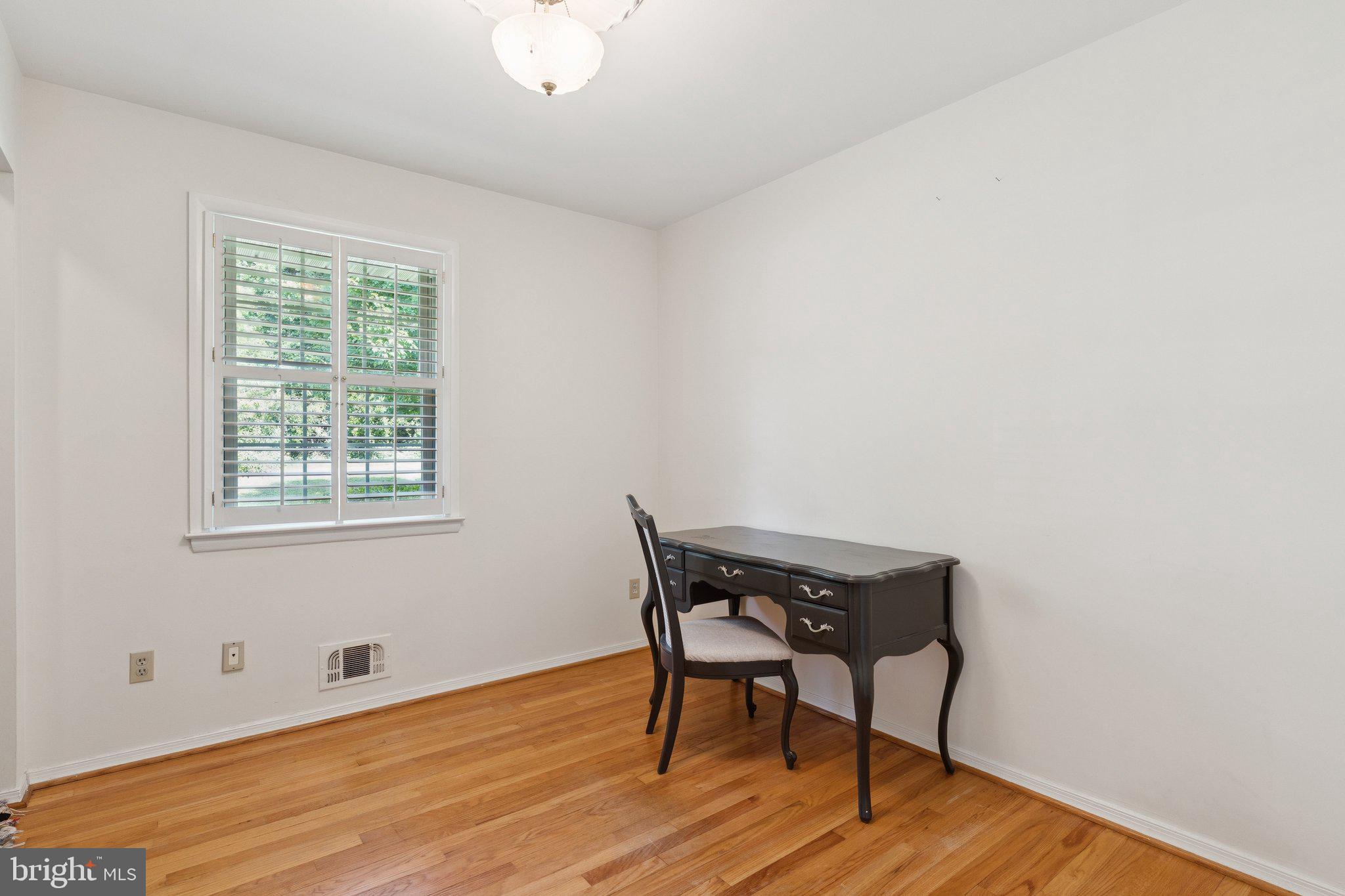 346 Edgewater Road Pasadena, MD 21122 - Photo 36 of 75 a view of a workspace with wooden floor and a window