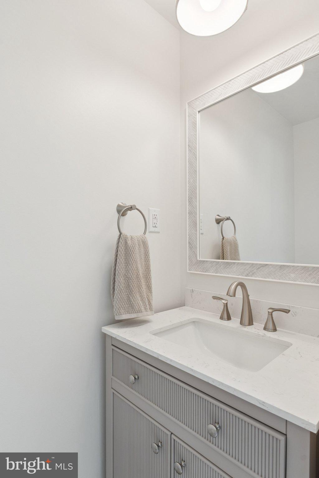 346 Edgewater Road Pasadena, MD 21122 - Photo 39 of 75 a bathroom with a sink and a mirror