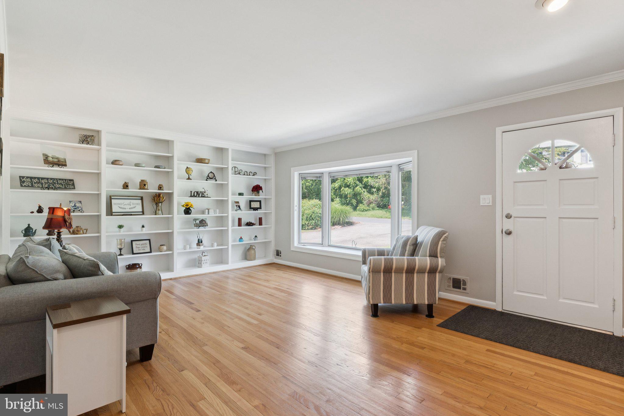 346 Edgewater Road Pasadena, MD 21122 - Photo 4 of 75 a living room with furniture and a wooden floor