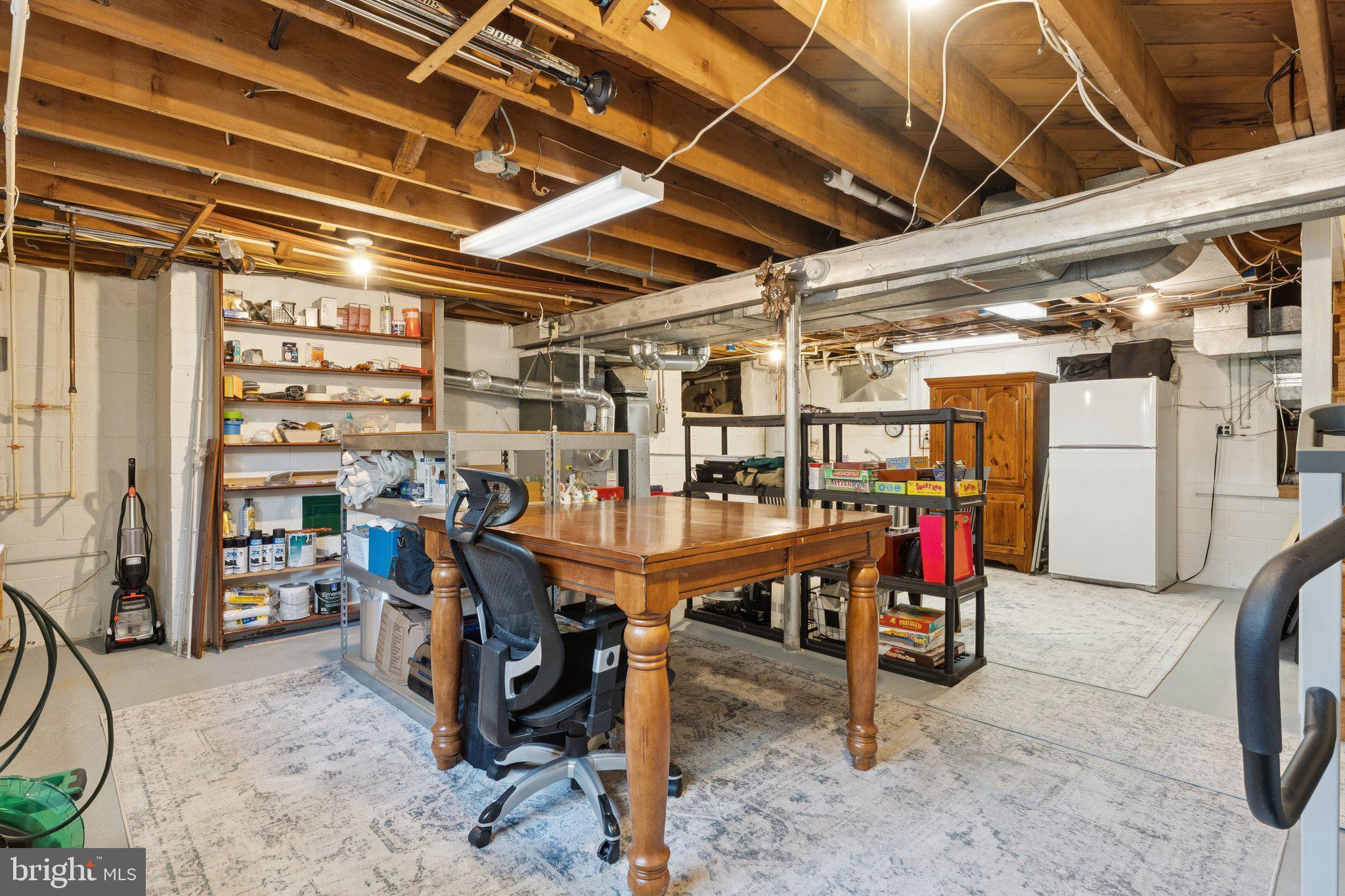 346 Edgewater Road Pasadena, MD 21122 - Photo 41 of 75 a view of a storage room with a table and chairs