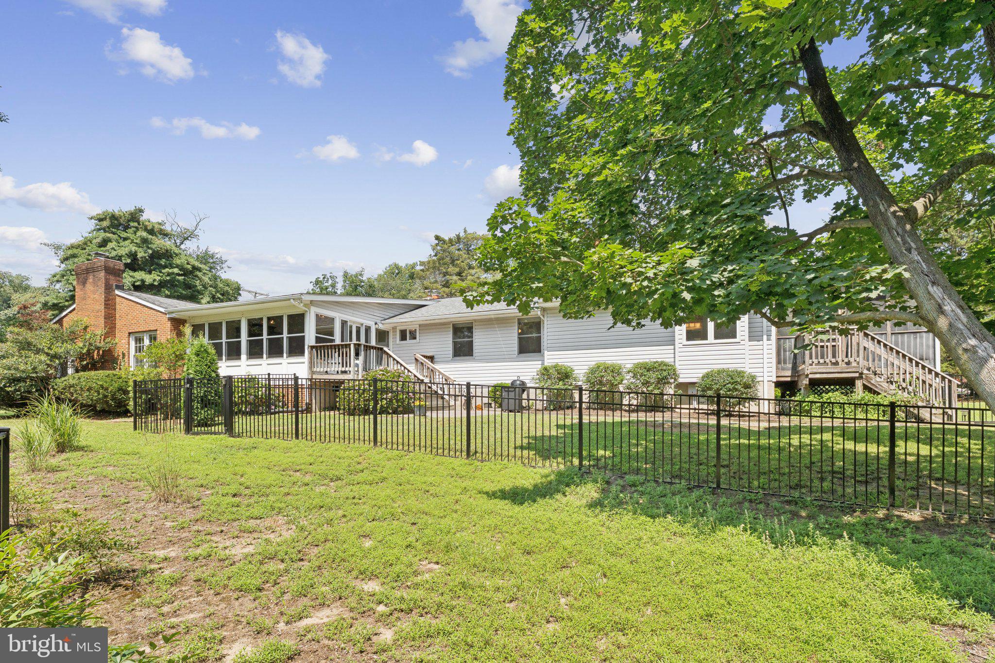 346 Edgewater Road Pasadena, MD 21122 - Photo 44 of 75 a view of a house with a big yard and plants