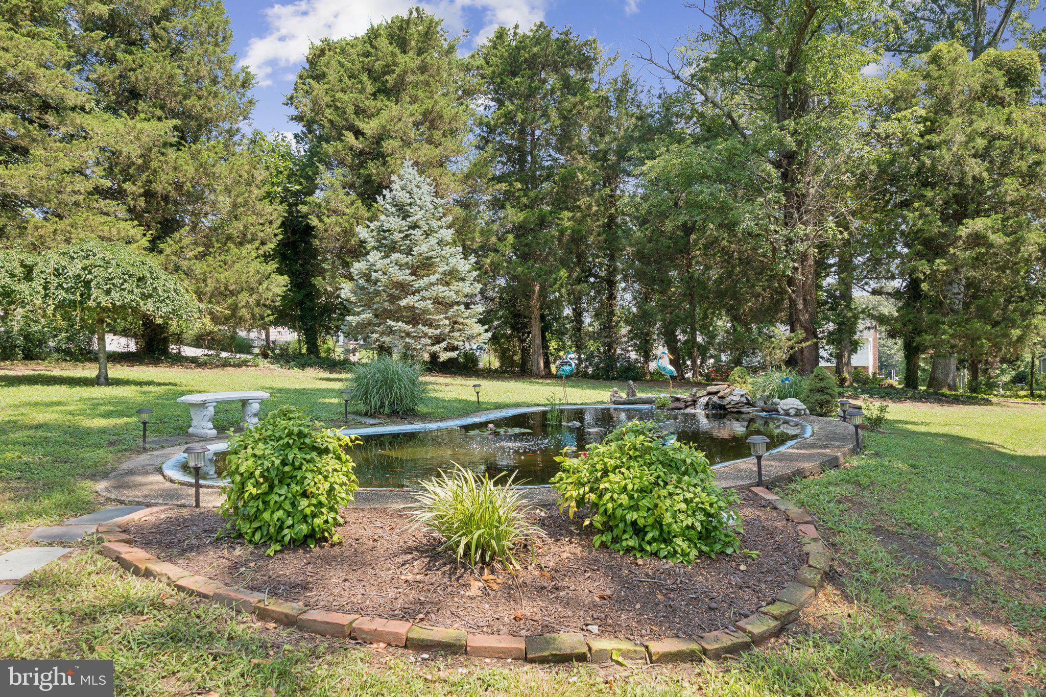 346 Edgewater Road Pasadena, MD 21122 - Photo 49 of 75 a view of a lake with a yard