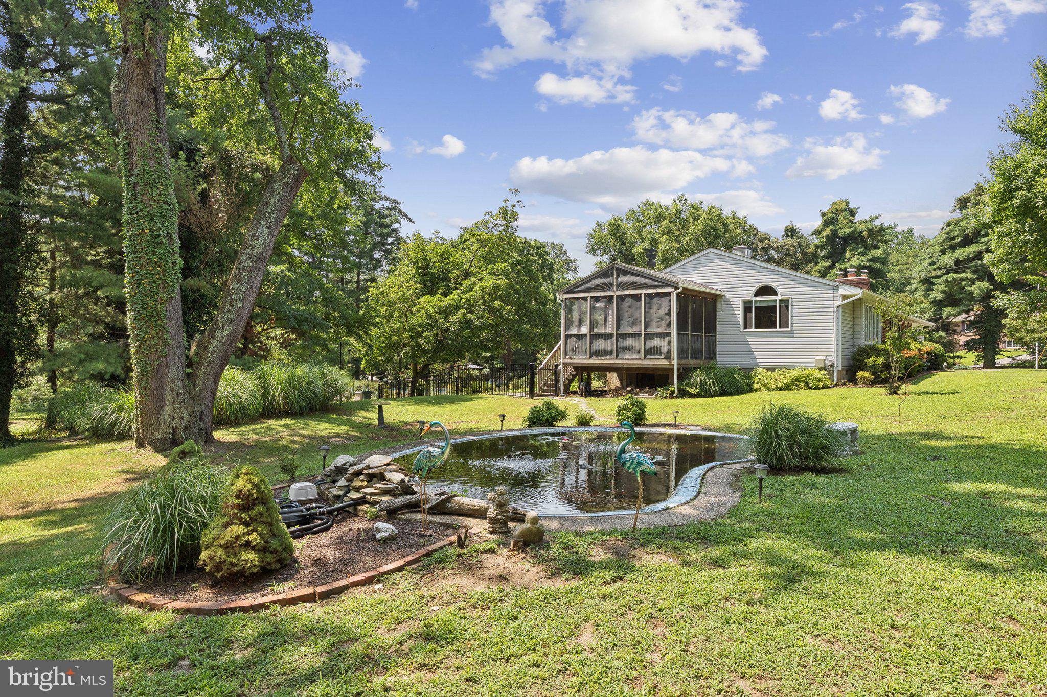 346 Edgewater Road Pasadena, MD 21122 - Photo 52 of 75 a view of a house with a yard