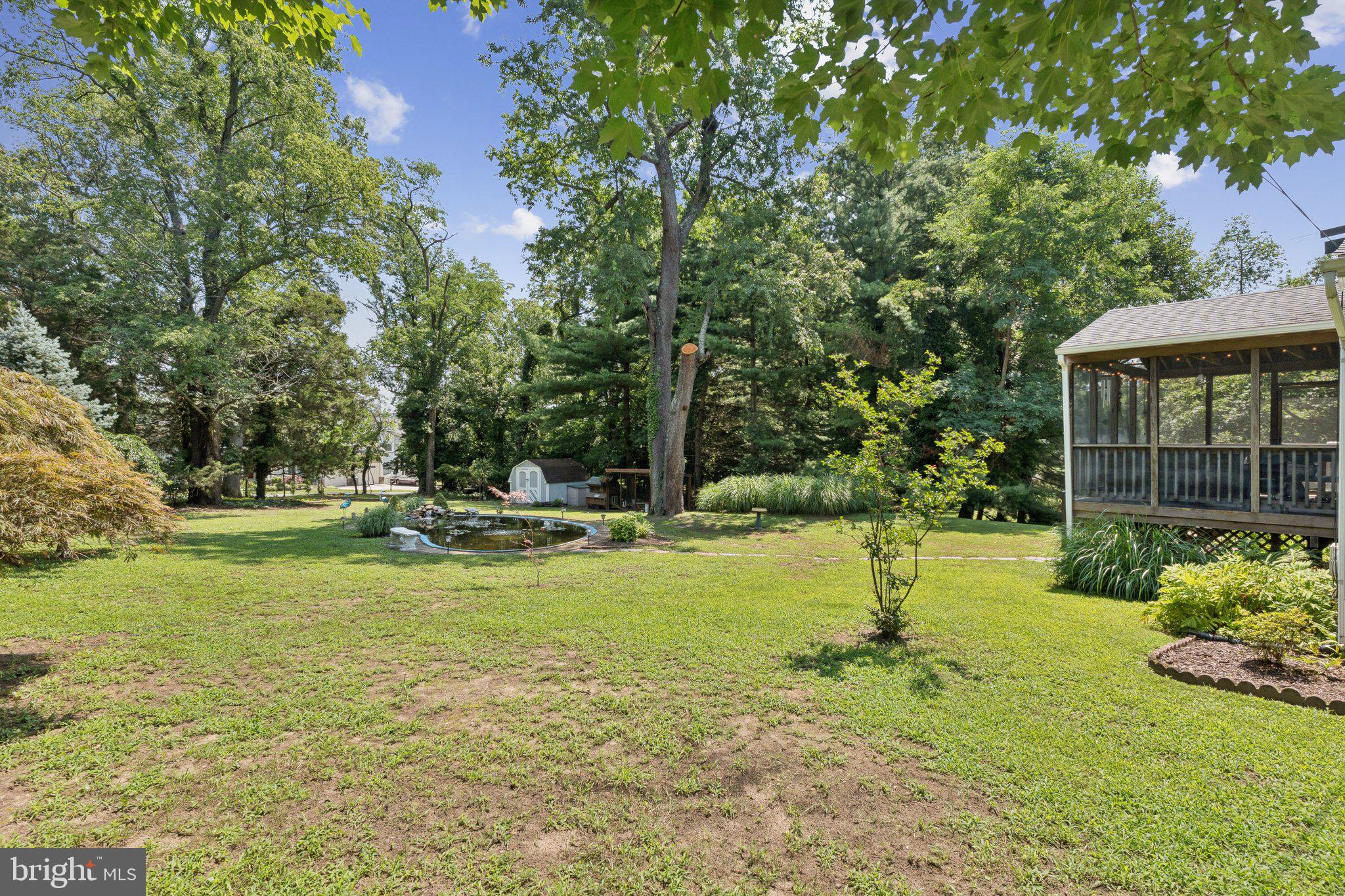 346 Edgewater Road Pasadena, MD 21122 - Photo 53 of 75 a view of a swimming pool with a garden