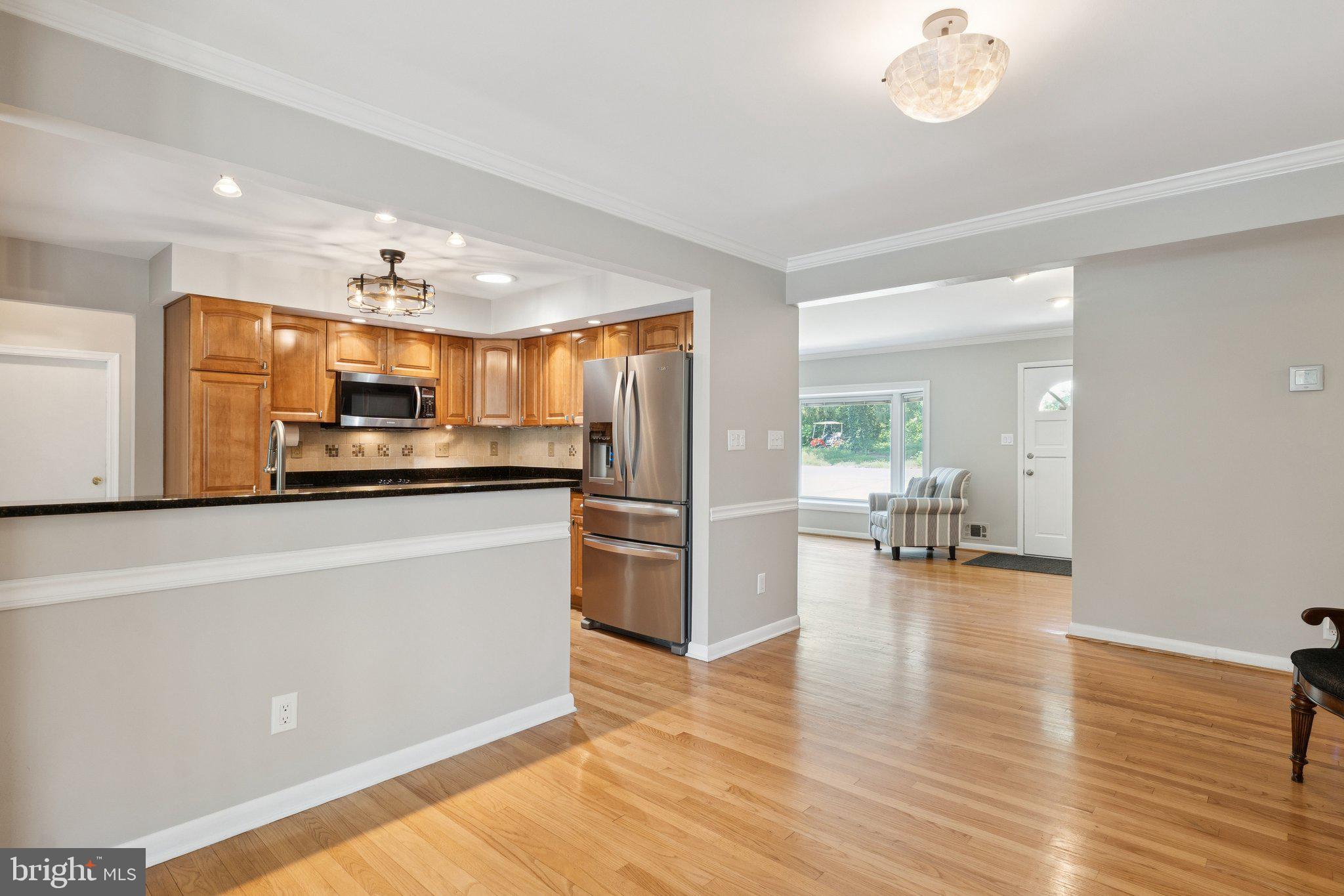 346 Edgewater Road Pasadena, MD 21122 - Photo 10 of 75 a kitchen with stainless steel appliances a refrigerator and a stove top oven