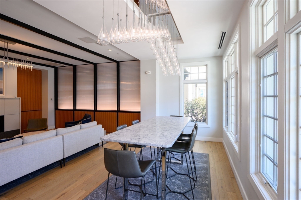 10 Shipyard Drive, Unit 402 Hingham, MA 02043 - Photo 15 of 25 a view of a dining room with furniture window and wooden floor