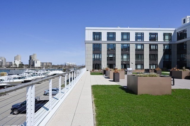 10 Shipyard Drive, Unit 402 Hingham, MA 02043 - Photo 21 of 25 a view of a house with backyard and sitting area