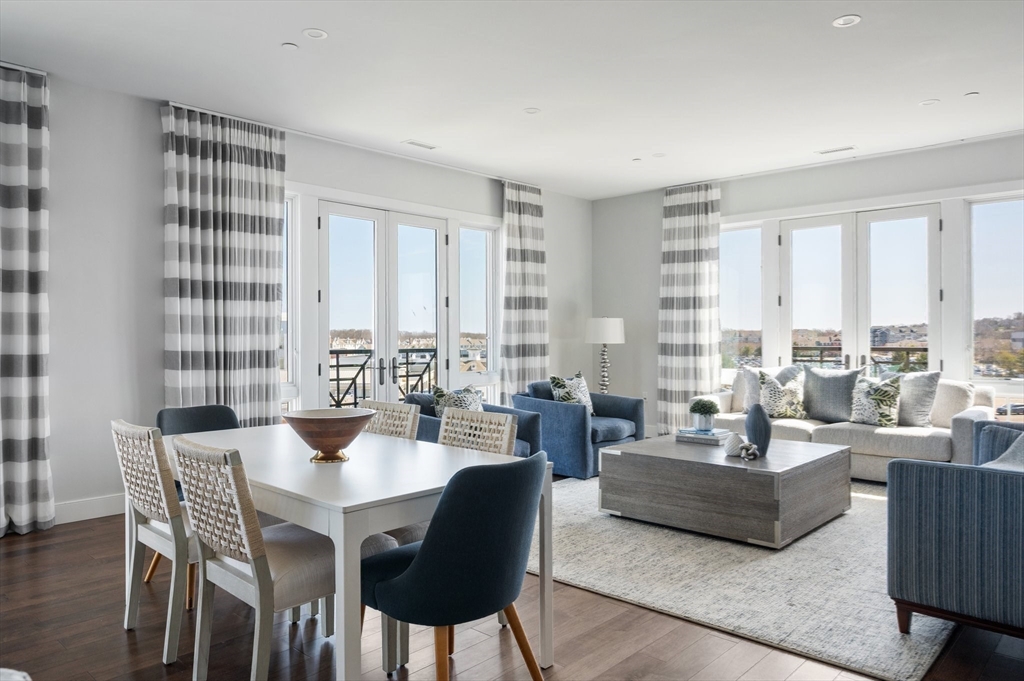 10 Shipyard Drive, Unit 402 Hingham, MA 02043 - Photo 3 of 25 a living room with furniture and large windows