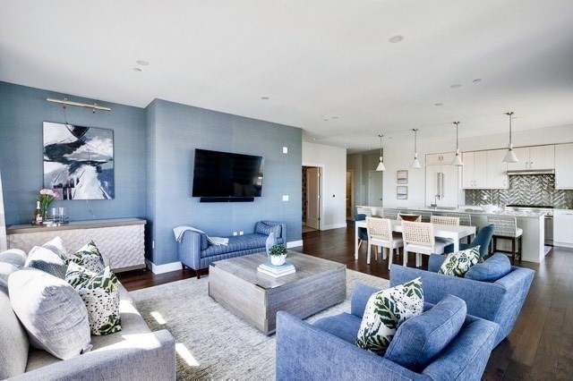 10 Shipyard Drive, Unit 402 Hingham, MA 02043 - Photo 6 of 25 a living room with furniture kitchen view and a flat screen tv