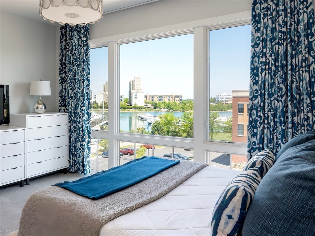 10 Shipyard Drive, Unit 402 Hingham, MA 02043 - Photo 9 of 25 a bed room with a bed and a window