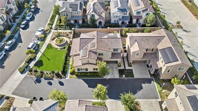 an aerial view of houses with outdoor space