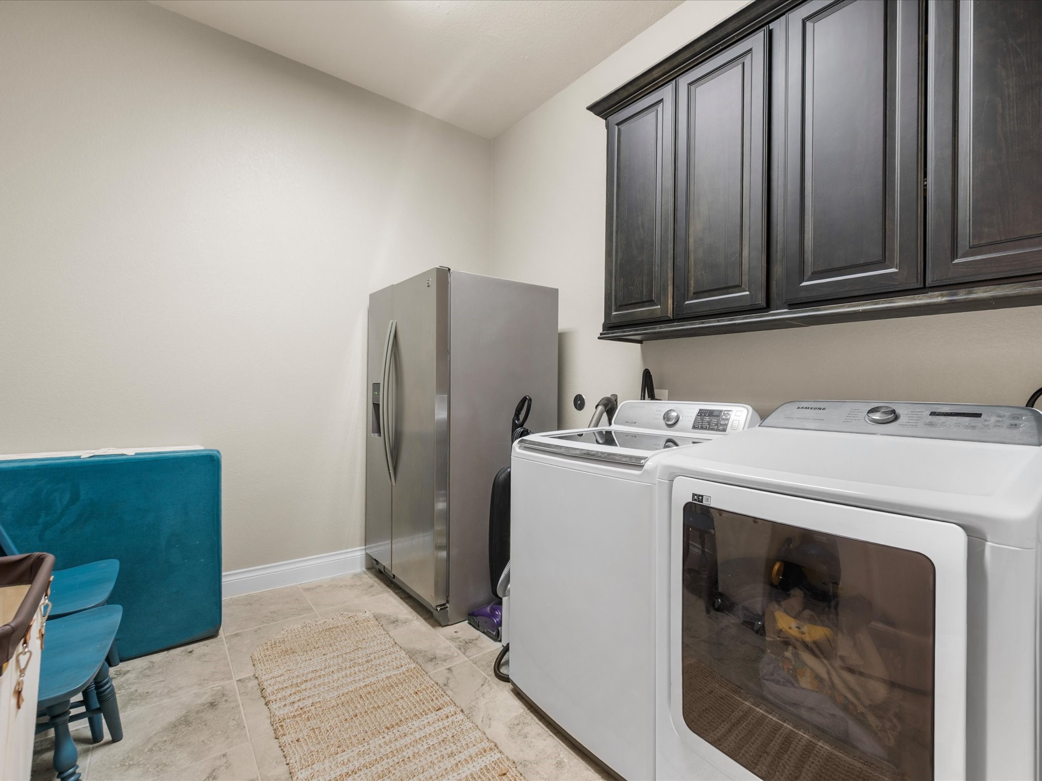 12618 Ranger Court Magnolia, TX 77354 - Photo 31 of 45 A multifunctional laundry room that houses the washer/dryer alongside mechanical equipment or storage.
