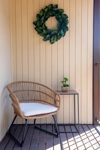 a view of a balcony with furniture