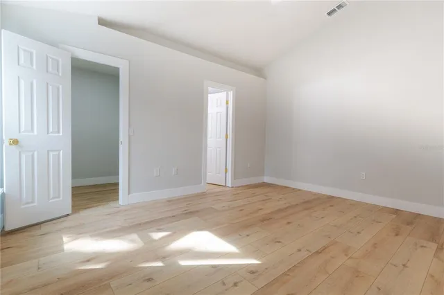 a view of an empty room and window