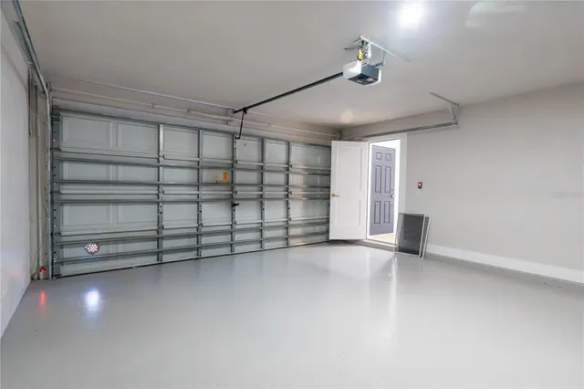 a view of an empty room with a cabinet