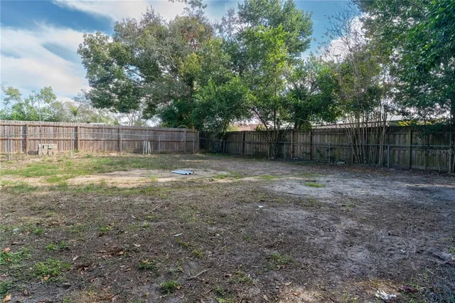 a view of a backyard with a trees