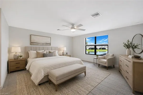 a spacious bedroom with a bed and a window