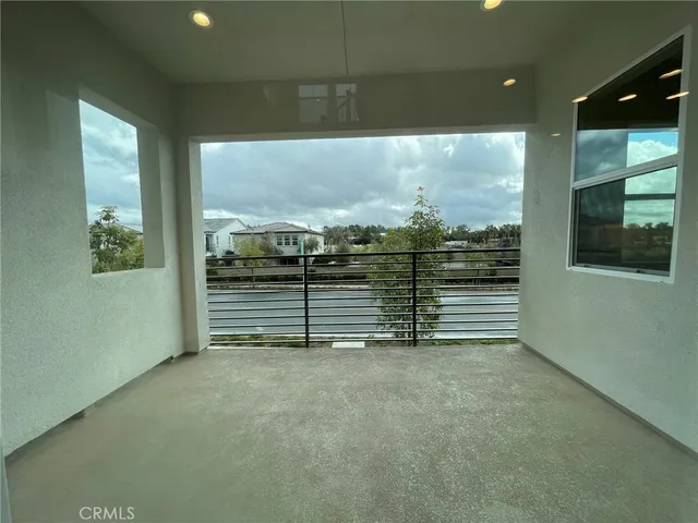 a bathroom with a granite countertop toilet a sink and a mirror