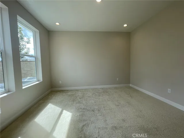 an empty room with windows