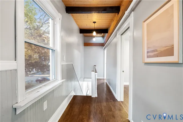 a view of an entryway with wooden floor