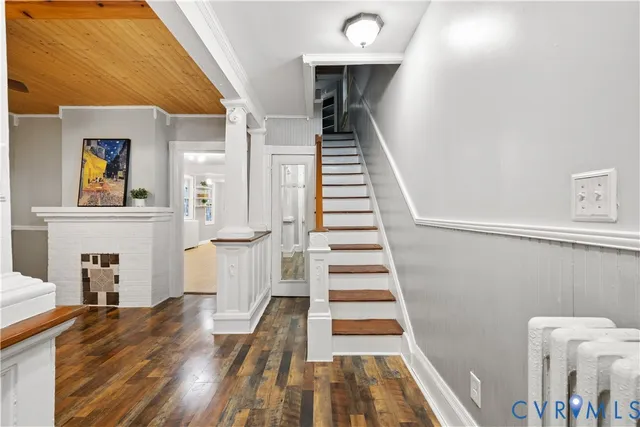 a view of a entryway with furniture and wooden floor