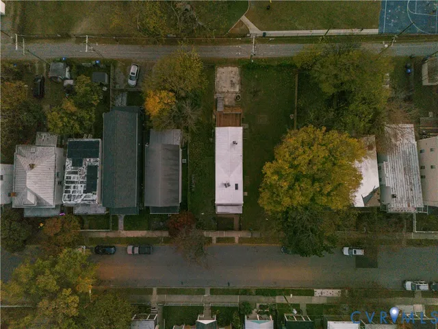 an aerial view of a residential houses with outdoor space
