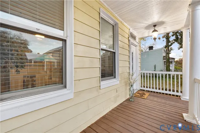 a view of a balcony with wooden floor