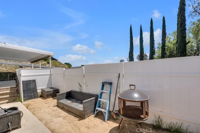 a view of a balcony with chairs
