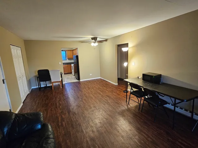 a workspace with furniture and wooden floor
