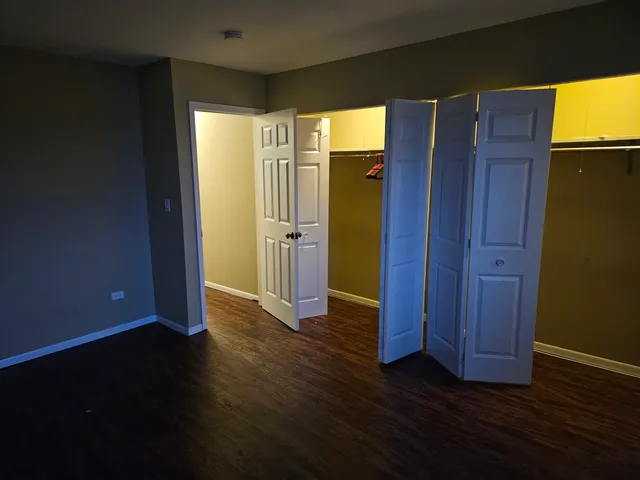 a view of front door with wooden floor