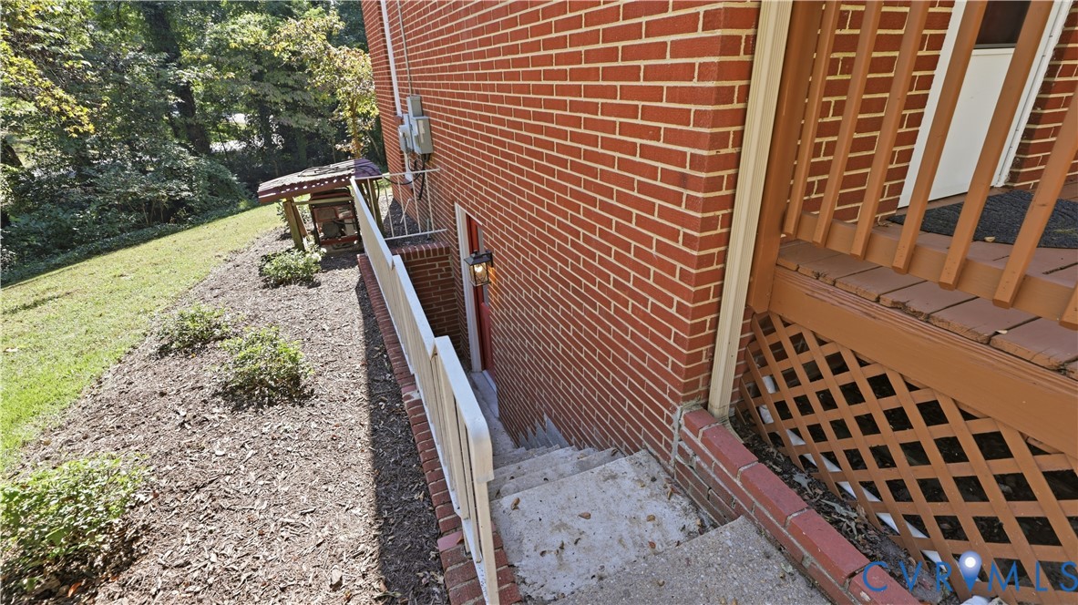 2301 Traymore Road North Chesterfield, VA 23235 - Photo 55 of 67 Red brick exterior with concrete steps, white hand