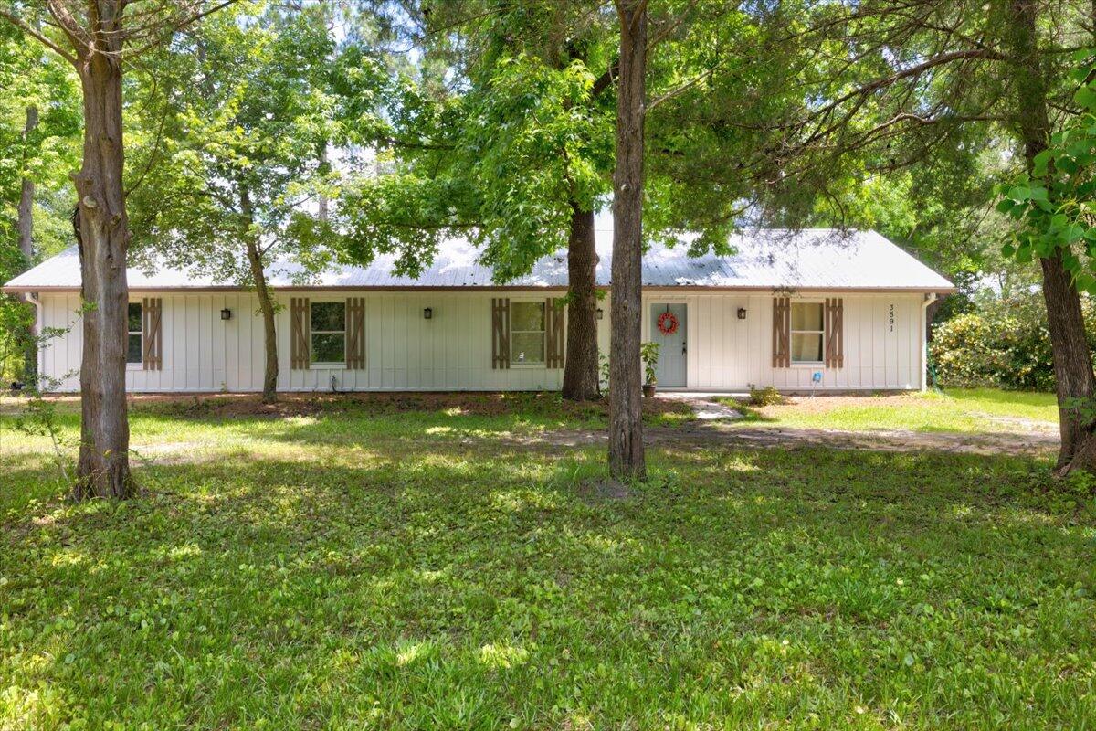 3591 Highway 20 Freeport, FL 32439 - Photo 3 of 23 a view of a house with a backyard