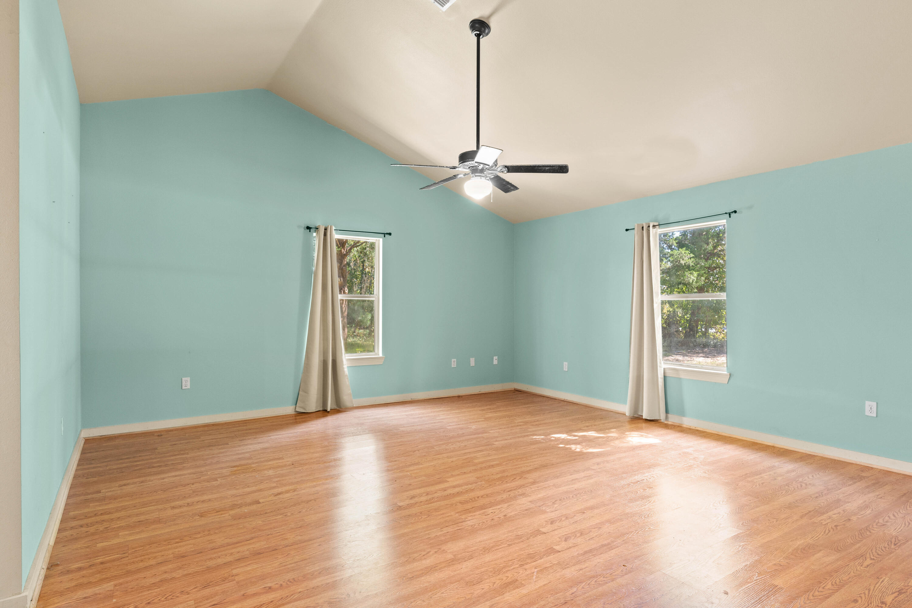 3591 Highway 20 Freeport, FL 32439 - Photo 8 of 23 a view of an empty room with window and chandelier fan